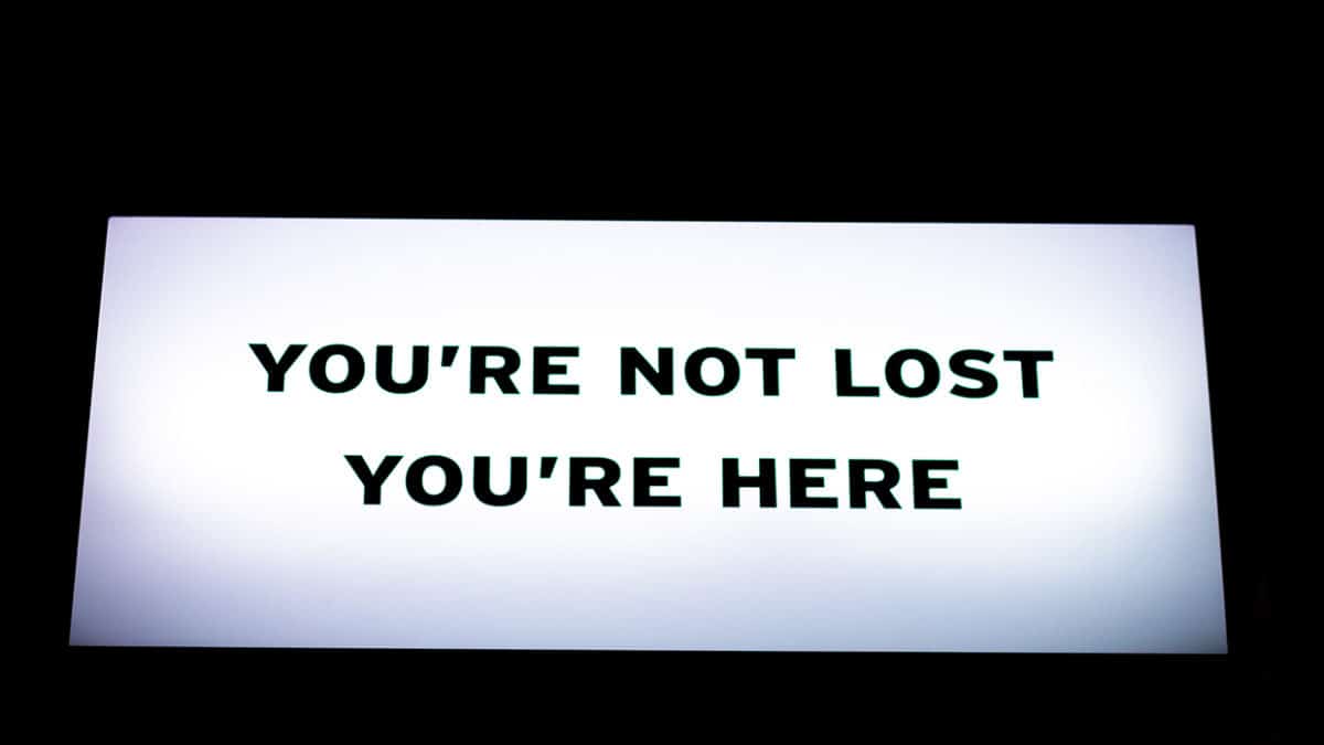 Sign that says "You're not lost. You're Here."