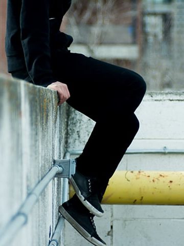 Man sitting on ledge