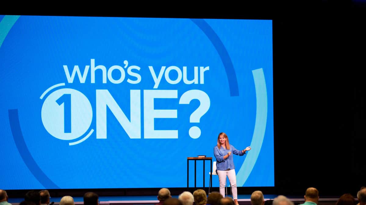 Catherine Renfro, a marketing consultant in evangelism at the North American Mission Board (NAMB), shares practical evangelism experience at Who's Your One Tour locations. Here, she addresses the audience during the stop at Prestonwood Baptist Church in Dallas
