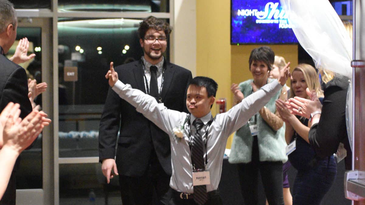 Night to Shine guest walks down the red carpet
