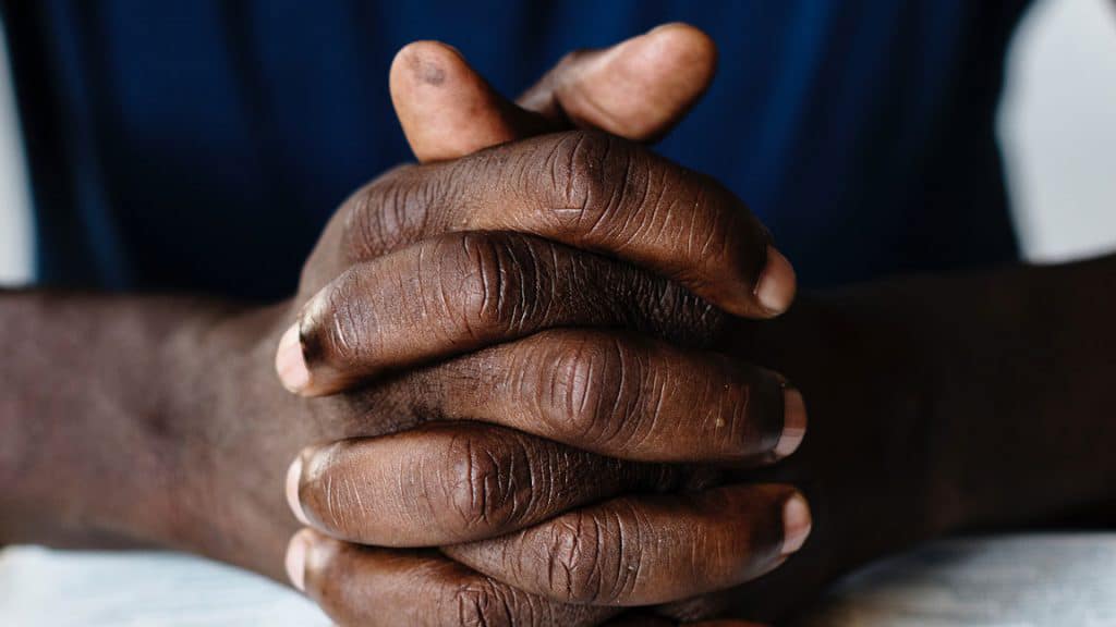 Hands folded in prayer