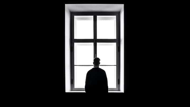 Man looking out the window