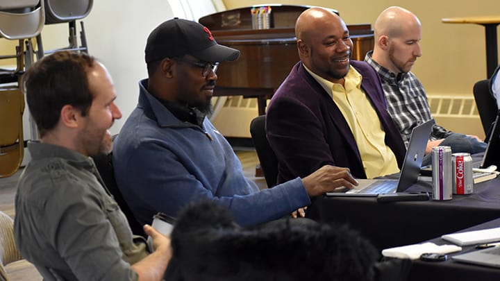 Pastors Gathered At A Table To Discuss Racial Reconciliation
