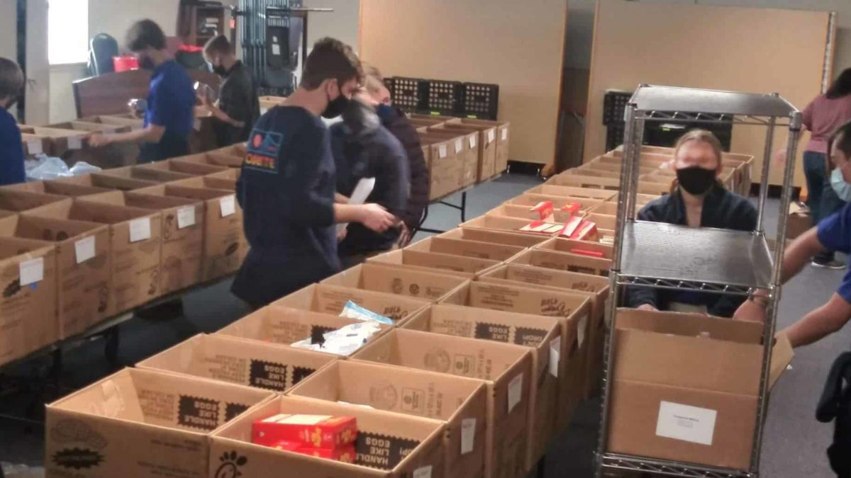 Cultivate Church volunteers packing boxes