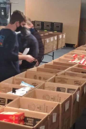 Cultivate Church volunteers packing boxes