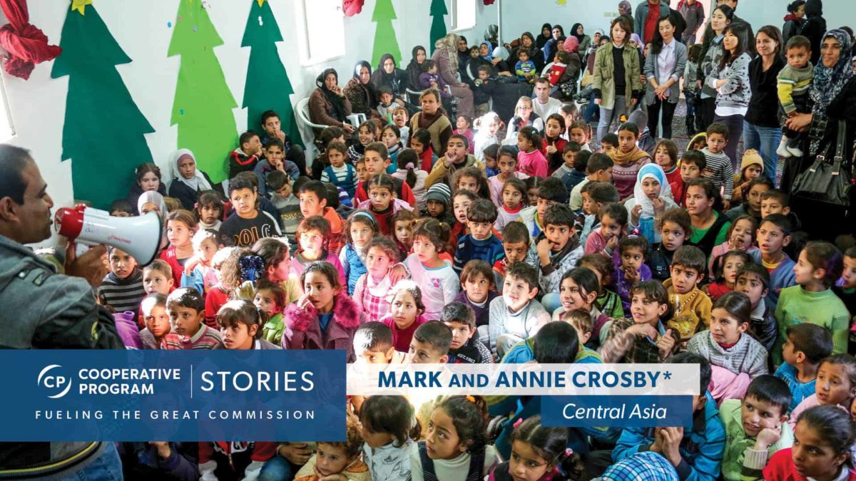 Young Asian children seated at Christmas program