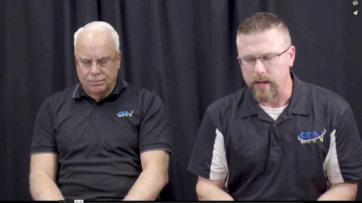 Barry Whitworth and Andy Weber pray