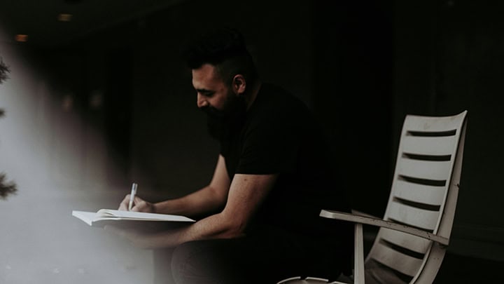 Man writing in a journal