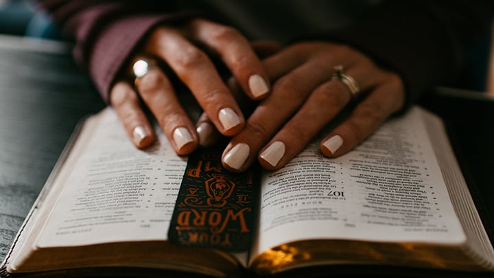 Woman's Hands, Praying Over Bible