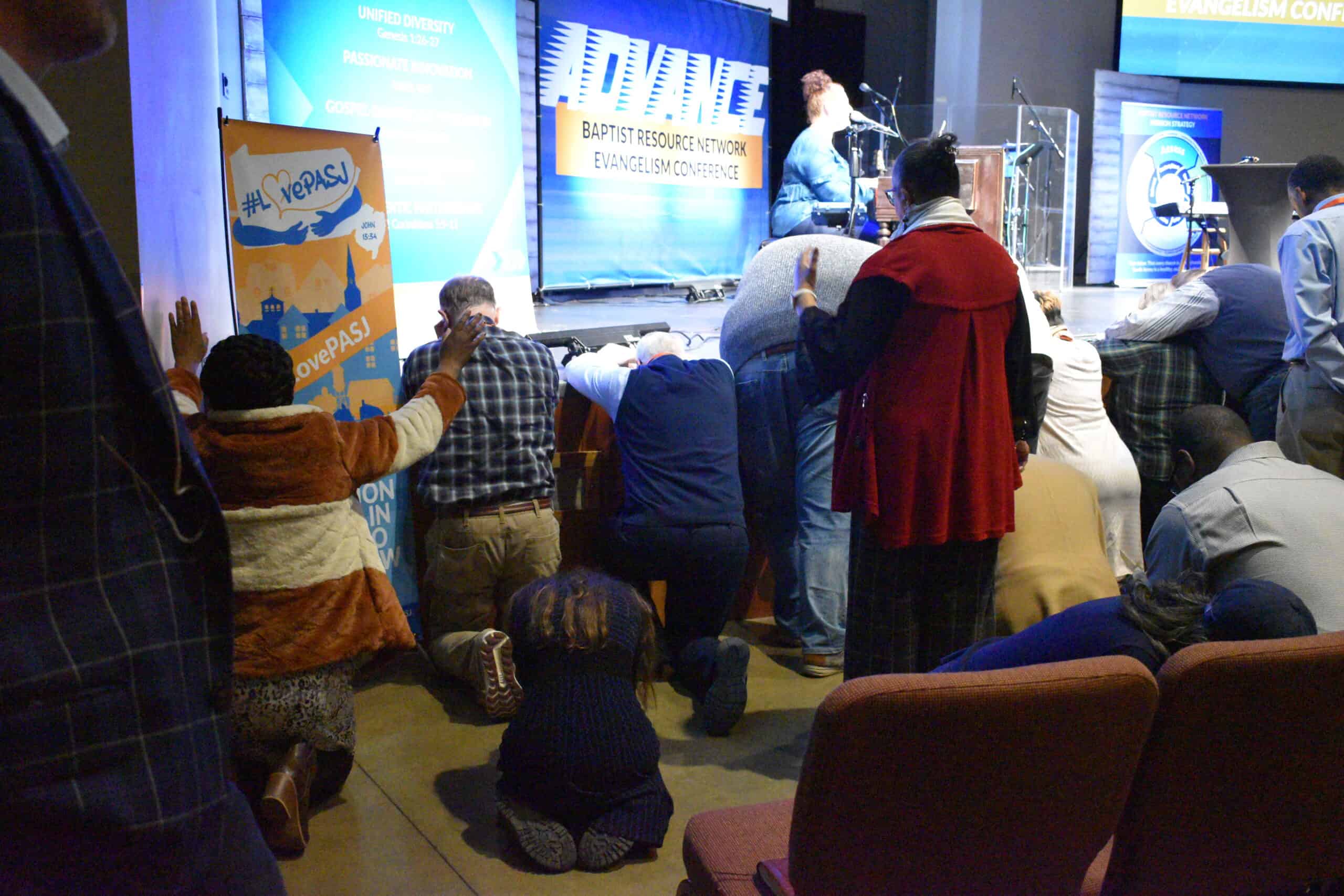 People praying at altar