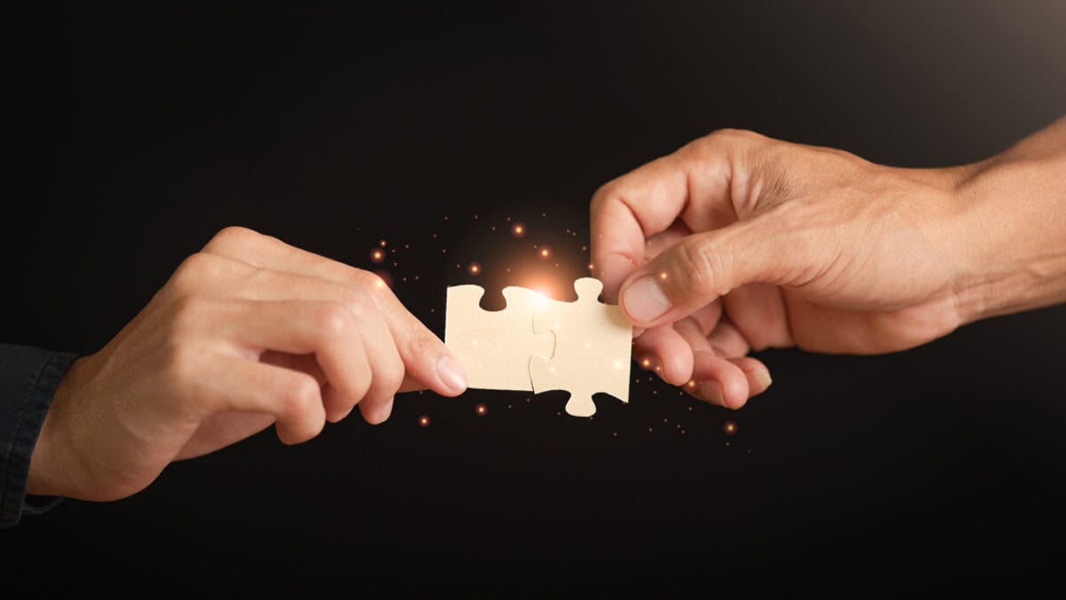 Two leaders with puzzle pieces
